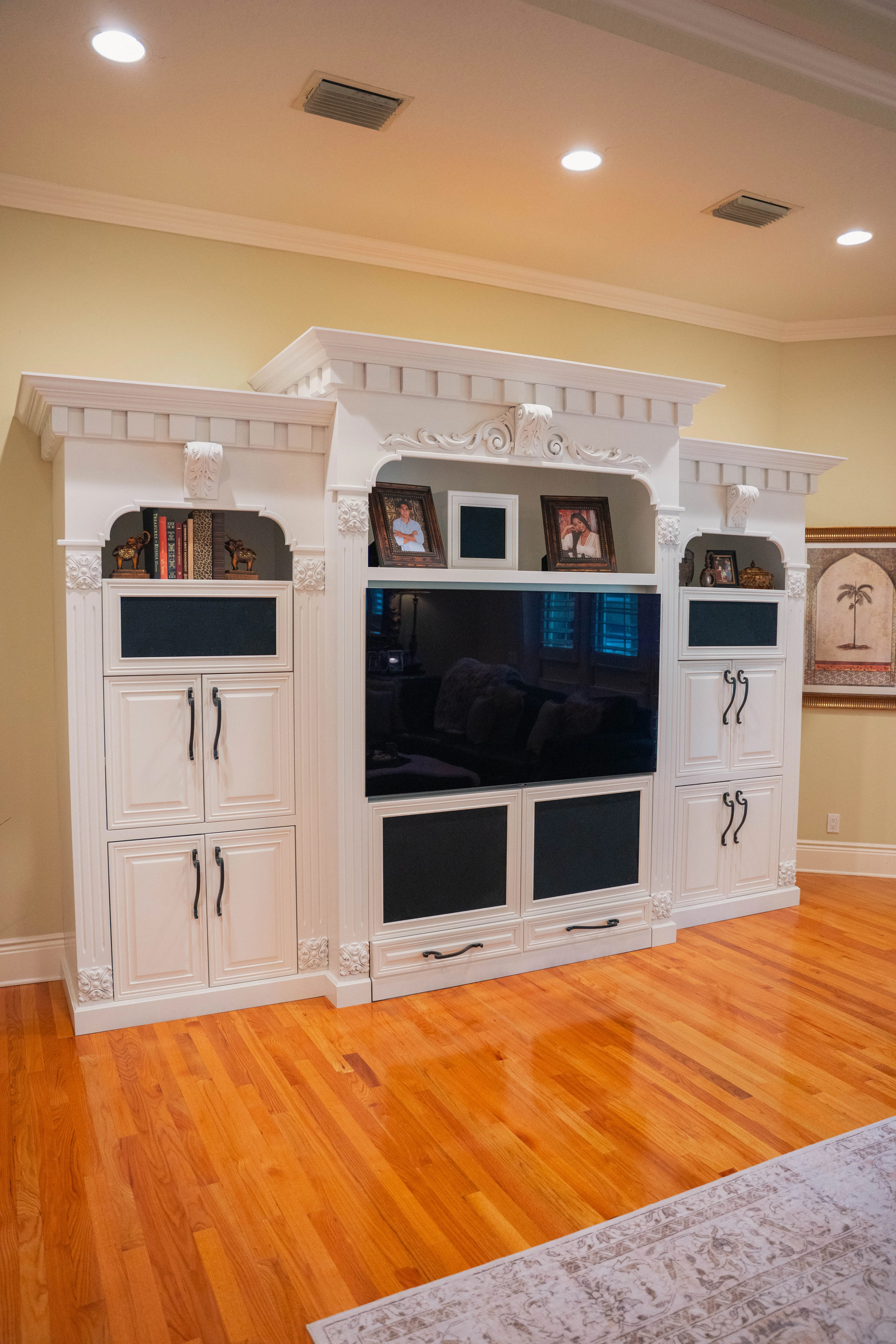 Remodeled kitchen with gold cabinetry and pendant lighting